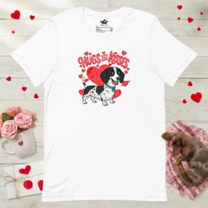 Front view of a white t-shirt featuring a black and white dapple dachshund graphic surrounded by red hearts.