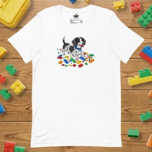 A white unisex t-shirt featuring a colorful graphic of a dachshund "built" out of retro toy building blocks.
