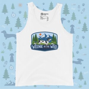 A flat-lay mockup of a solid white tank top featuring the rectangular "Weenie in the Wild" emblem centered on the chest. The background consists of a light blue print featuring dachshund silhouettes, tents, and trees.